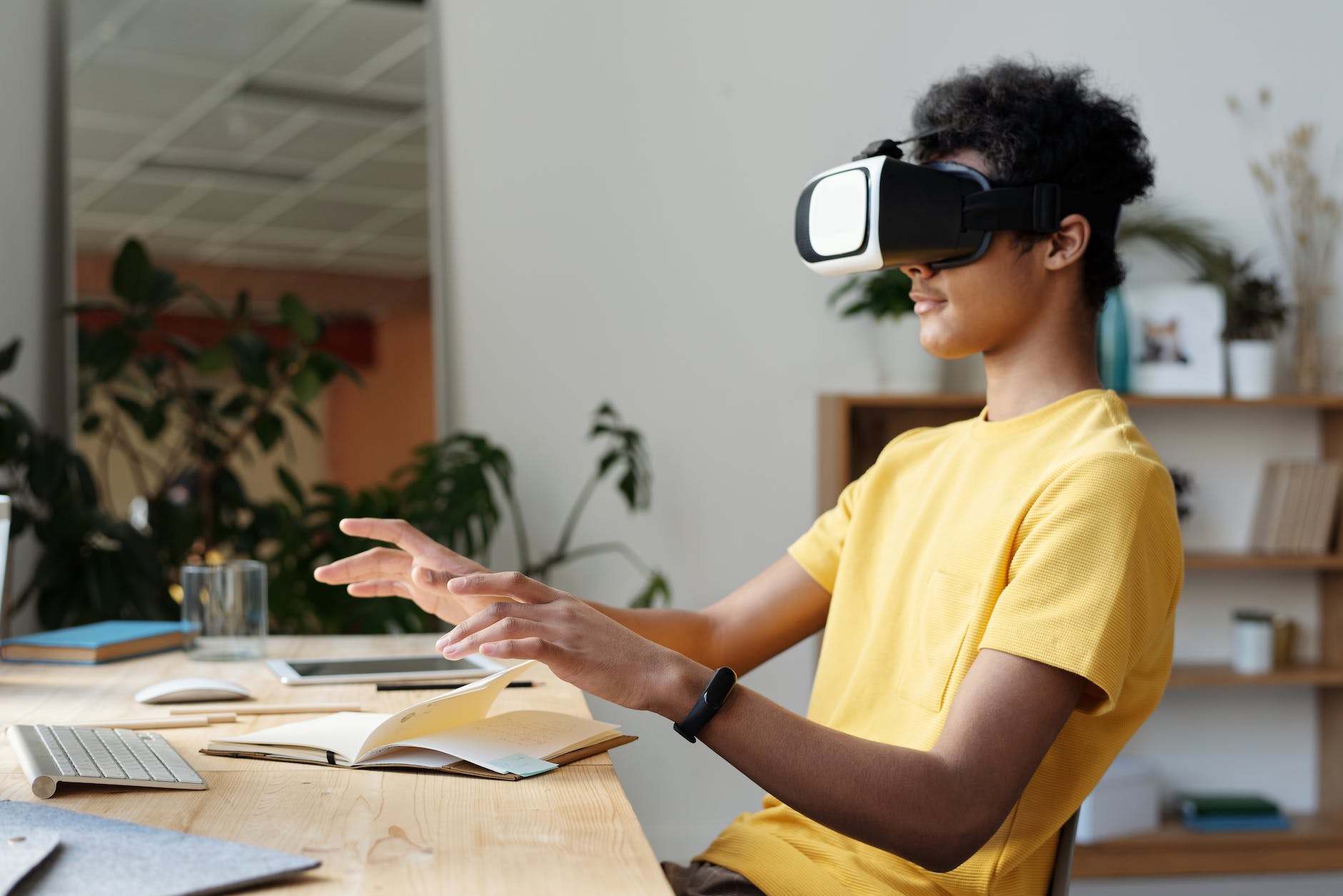 man in yellow crew neck t shirt using vr headset